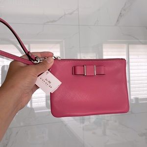 Coach wristlet with bow. Brand new with tags.